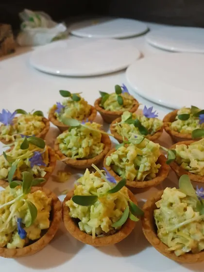 A tray of my avocado and corn tartlets, ready to be served. These are always a crowd-pleaser at my events.