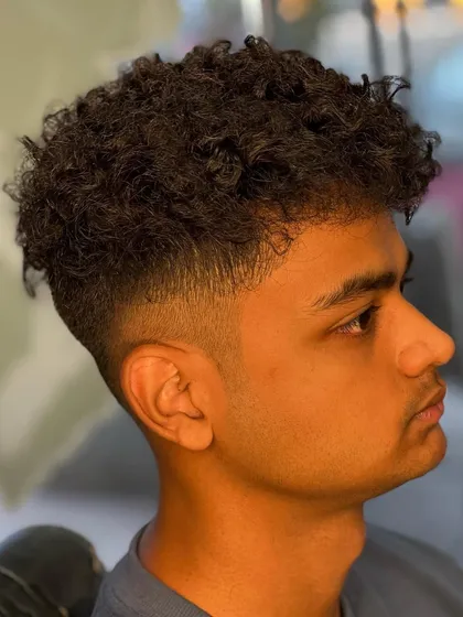 Another angle of this curly hairstyle, showing the texture and shape of the cut.