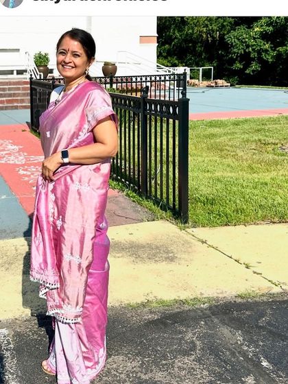 Another view of the custom-embroidered Kutch work saree, showing how the delicate white threadwork stands out against the soft pink silk.