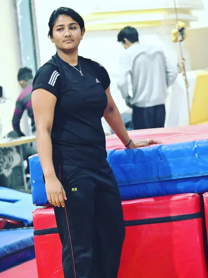 One of our dedicated coaches, standing proud in the academy she helps build every day.