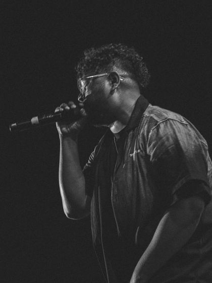 A classic black and white shot, focused on the performance. No distractions, just the music.