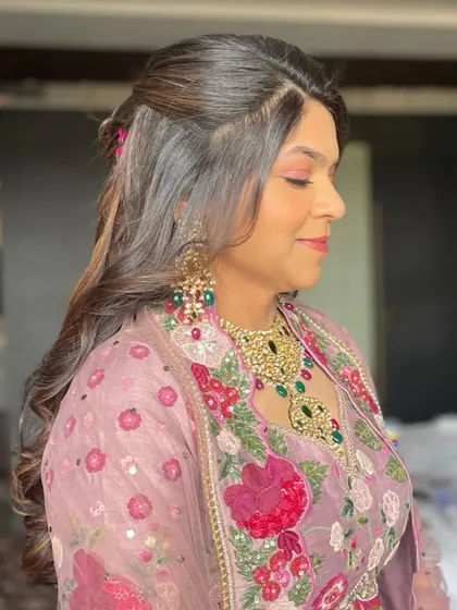 A side profile of the carnival hairstyle, showing how the soft curls frame the face.