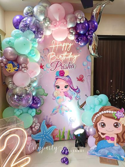 Another angle of the mermaid party decor, highlighting the mix of chrome and pastel balloons.