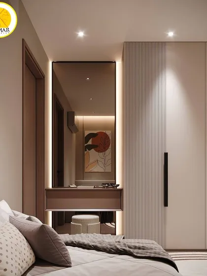 The design includes a compact dressing table with a backlit mirror, seamlessly integrated next to the wardrobe.