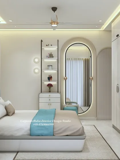 A full view of the bedroom, showing the elegant dressing area with a backlit oval mirror and a stylish display shelf.