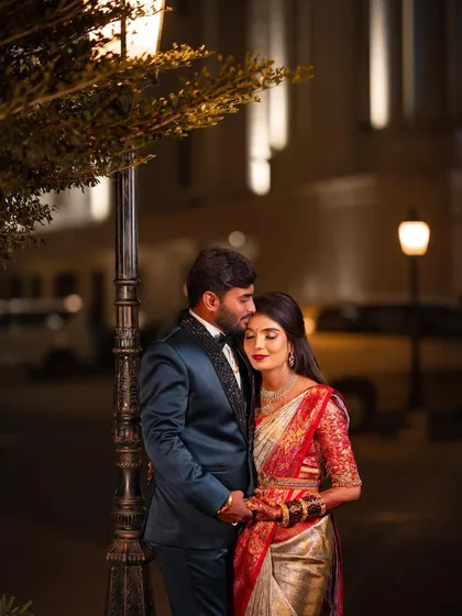 A romantic evening shot of the couple. The makeup I designed for her was meant to look beautiful in all lighting conditions, from bright lights to this moody, romantic setting.
