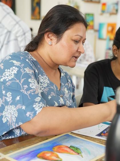 An instructor helps a student with her soft pastel assignment during a CFA class. We are there to guide you at every step.