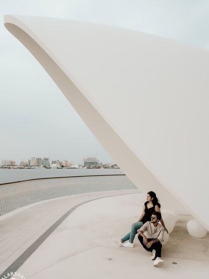 A creative composition using the sweeping white architectural lines to create a minimalist and impactful photo.