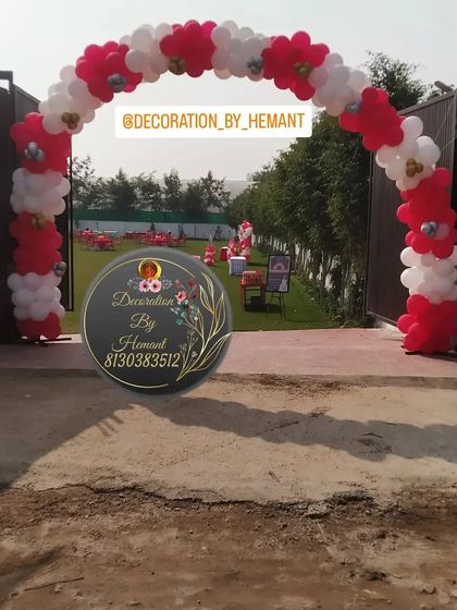A simple yet classic red and white balloon arch I created for the entrance to the outdoor carnival party. This archway welcomed guests into the large lawn where the main event was set up.