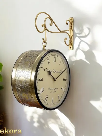 Our vintage-inspired Victoria station clock features a dual-sided face and detailed brass carving, bringing timeless elegance to your decor.