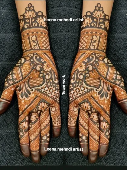 A collaborative piece of teamwork for a bridal party. This design features intricate peacock and floral motifs, with a mix of bold and fine lines creating a rich, textured look.