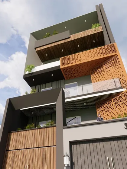 A facade where minimalism is juxtaposed with rich textures and earthy shades. A large perforated metal screen acts as a decorative sun-cutter, adding a unique feature to the otherwise clean and modern design.