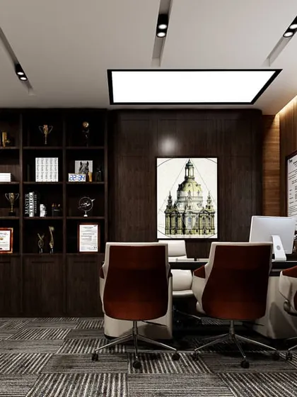 The executive cabin of an office, featuring a large desk, a conference area, and custom-built shelving for awards and books. The dark wood and sophisticated lighting create an atmosphere of authority and professionalism.