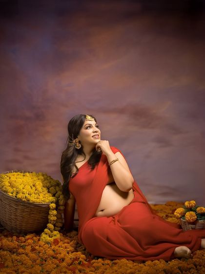 A modern goddess. Seated amidst a field of marigolds with a basket of flowers beside her, this portrait is a powerful and beautiful celebration of life, color, and cultural roots.