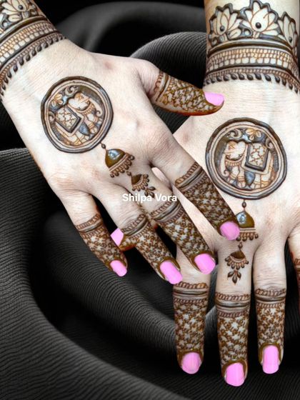 The same elephant and 'jhumka' design against a dark background, highlighting the intricate details.