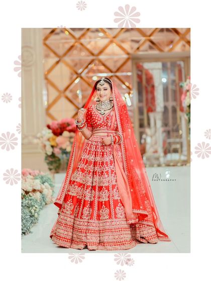 A full-length shot showing the bride's grand lehenga and the beautiful decor, all coming together for a perfect wedding photo.