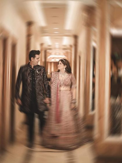 A dynamic shot using a motion blur effect as the couple walks down a hallway. This creative technique adds a sense of energy and excitement, as if capturing a fleeting, magical moment in time.