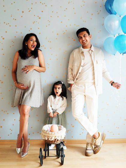 Candid moments during a home session. I love capturing the natural dynamic of a family in their own space, which often results in the most relaxed and joyful photographs.