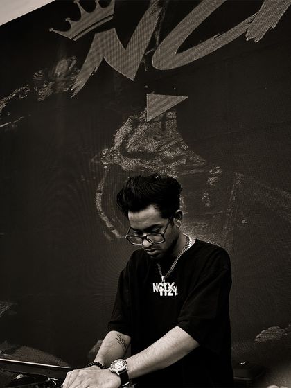 A black and white shot of me at the console during the Mosaic fest at Ramjas College. It captures the focus and intensity I bring to every live performance.
