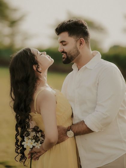 An intimate close-up capturing the chemistry between the couple. This natural light portrait focuses on their expressions and the tender connection they share.