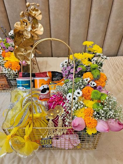 This super quirky wedding trousseau is nailing it with a pop of color and a modern metal basket. It’s a fun and vibrant take on traditional gifting, perfect for a couple with a playful style.