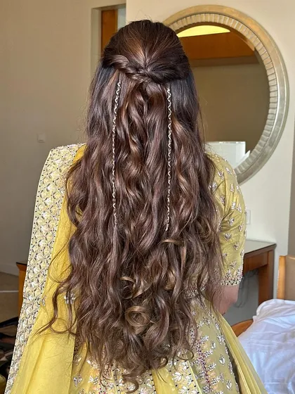 The full back view of the simple half-updo, showcasing the length and beautiful texture of the waves.
