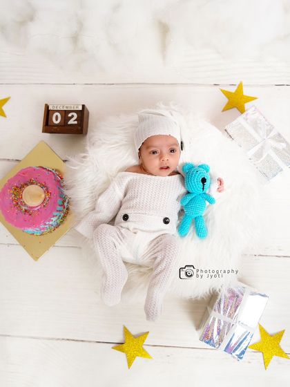 Another adorable top-down view from the milestone session, this time with a little blue teddy bear. I use a variety of props to add color and interest to the photos.