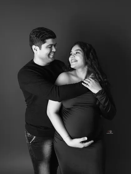 The joy and excitement of waiting for baby. This black and white photo highlights the happy, loving smiles shared between this couple during their maternity shoot.