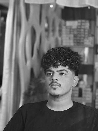 Another artistic shot of our hair perming work. Curls add so much character and style.