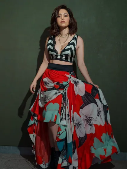 Ready for a pool party! I styled Nushrratt Bharuccha in this edgy look, pairing a bold floral skirt with a striped crop top and combat boots for a fun, high-fashion contrast.