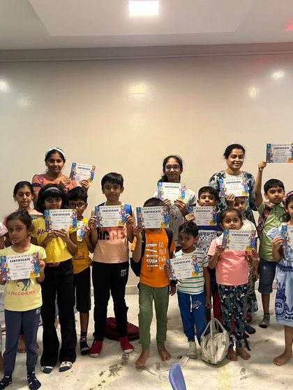 The whole group from our first summer camp batch proudly holds up their certificates. It's a wonderful memento of the friendships made and skills learned.