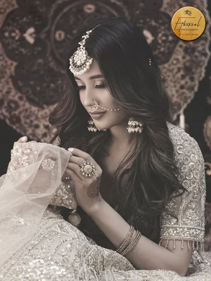 A beautifully edited, desaturated portrait that gives a timeless, vintage feel to the ethnic ensemble. This style of editing can add a unique mood to a fashion collection.