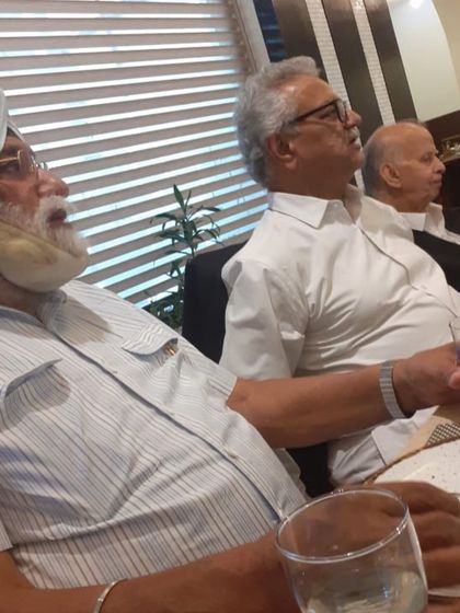 Listening to the conversations of my seniors. There is a lifetime of experience in the stories and advice shared at these tables.