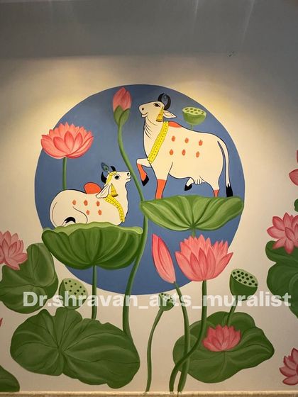 A serene Pichwai composition featuring two cows amidst a pond of lotuses. The soft blue circular background creates a calming, focused piece of art perfect for a peaceful corner.