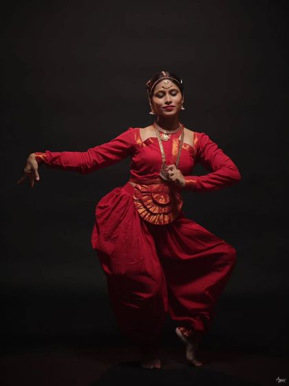 A graceful and powerful stance. This portrait showcases the elegance and strength required for classical dance, with every detail from her posture to her expression perfectly captured.