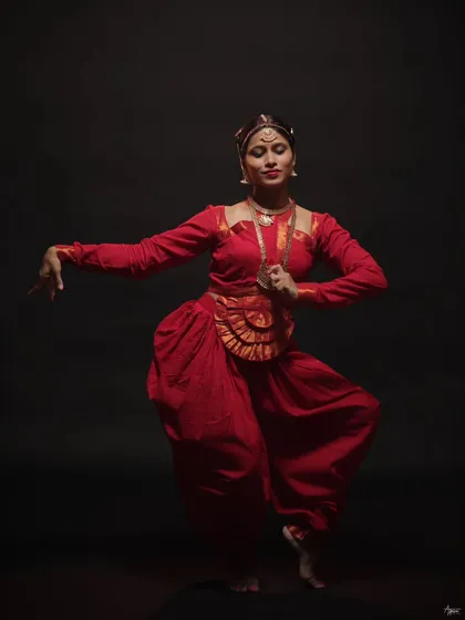 A graceful and powerful stance. This portrait showcases the elegance and strength required for classical dance, with every detail from her posture to her expression perfectly captured.