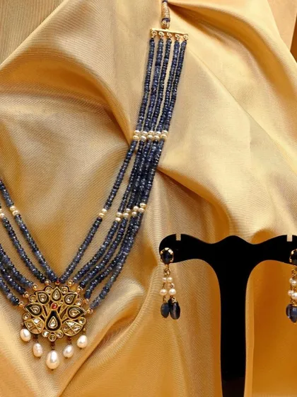 The complete set, including the peacock pendant necklace and matching sapphire eardrops. This was offered as part of our 'Ostentatious Peacocks' themed auction.