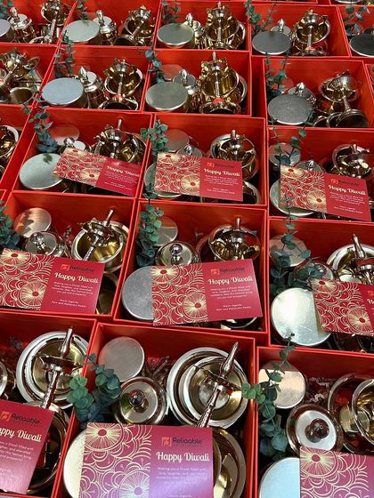 Adding the final touch with "Happy Diwali" cards to the Reliaable Developers gift boxes. Every detail is considered to make the gift special.