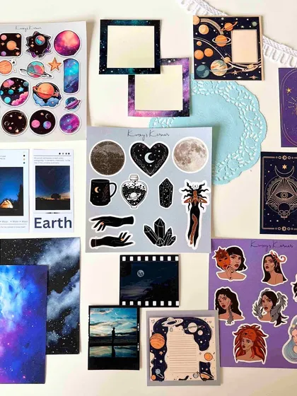 The Cosmic themed journaling kit, featuring planets, moons, and mystical illustrations for celestial-inspired pages.