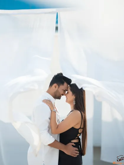This pre-wedding shot for Jui and Vaikrant uses simple elements like flowing white fabric to create a dramatic and timeless portrait. It’s a great example of how we can achieve a high-fashion, cinematic look in a natural setting.