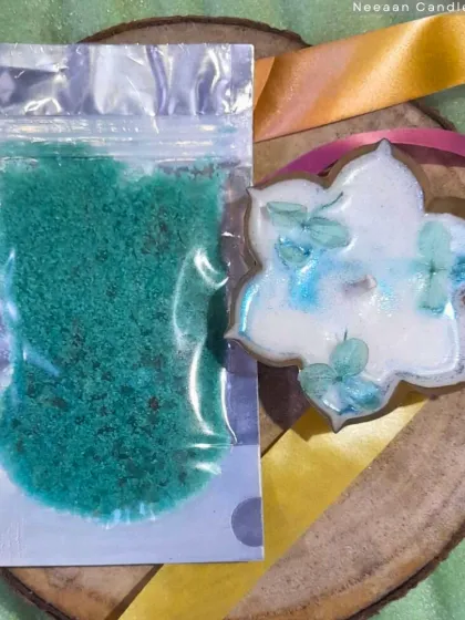 Unwind your soul with the calming glow of an Urli candle and soothing bath salts. This set is perfect for creating a wellness ritual.