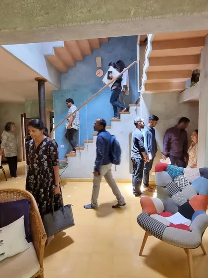 A home for a creative soul should be able to host a community. Here, the open-plan living area of the artist's residence becomes a gallery and gathering space, with people flowing naturally between the different levels.