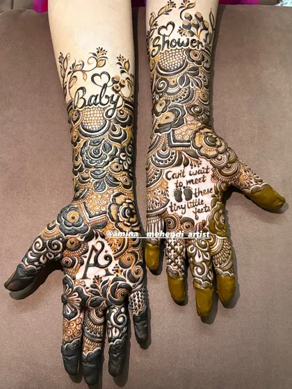 Another angle of the fresh baby shower mehendi, highlighting the delicate vines on the forearm and the personalized details on the palms.