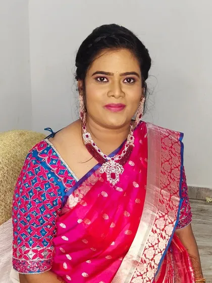 Another shot of Sarita's simple and elegant look, showing the soft makeup and neat hairstyle.