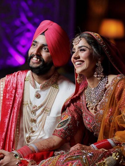 Another happy moment from their wedding, showcasing their beautiful smiles and her stunning jewellery.