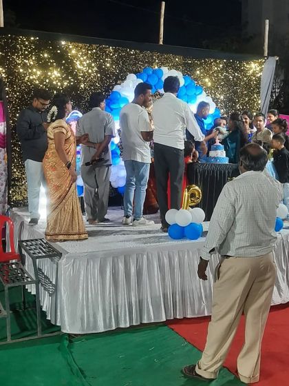 The birthday boy celebrating on stage. It's rewarding to see my work become the backdrop for such happy family moments.