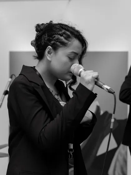 A black and white shot of me feeling the music. Even in a corporate setting, the performance is always filled with soul.
