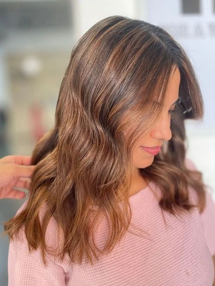 A side view of the attitude-changing hair, showing the soft waves and subtle highlights.