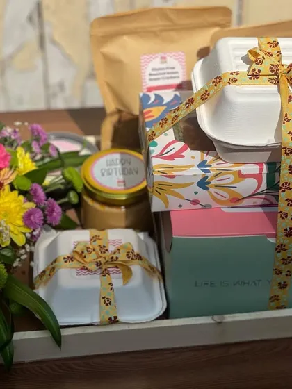 This hamper is a full meal experience. It combines my bento cakes and other sweets with savoury items, all beautifully packaged and tied together with a festive ribbon, complete with a fresh flower bouquet.