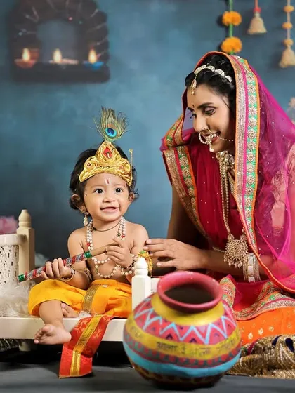 A happy interaction between mother and child in our Yashoda-Krishna themed shoot, filled with smiles and playfulness.